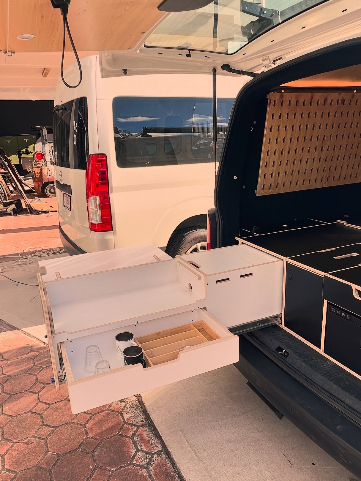 A Funky Transformation in Progress 🛠️🪚🪓
Featuring a bold and immersive theme design 🧰🥃🎺
From the outside, it’s a modern VW Multivan — inside, it’s a portal to another era. Inspired by the elegance and raw utility of the 1930s, this unique conversion features a theme design that blends military ruggedness with bourgeois charm, creating an immersive atmosphere of timeless character.
Custom details like leather, crystal glasses, a mini axe, and a portable firepit bring warmth and story to the space — it’s less about convenience and more about intention.
With lounge-style wall cushions, hidden compartments, and tactile materials throughout, this van is designed to slow you down, stir your senses, and reconnect you to a slower, more deliberate rhythm of life.
Whether it’s a solo escape, a fireside vermut, or a shared ritual under the stars, this van invites presence. It’s not just a ride — it’s a theme-designed experience, a journey through time, built for those who value atmosphere over automation, and story over speed.
#KataMultivan #Katatheme #themedesign #camperlife
#vanbuild #australiavanlife #fitoutvan #camperconversion #camperlife #nomadlife #VanLife #campervan #VanLife #TravelEssentials #fullconversion #vanconversion #vanlifevirals #campervanconversion #tinyhome #homeonwheels #vanlifeideas #offgrid #outdoorliving #roadtrip